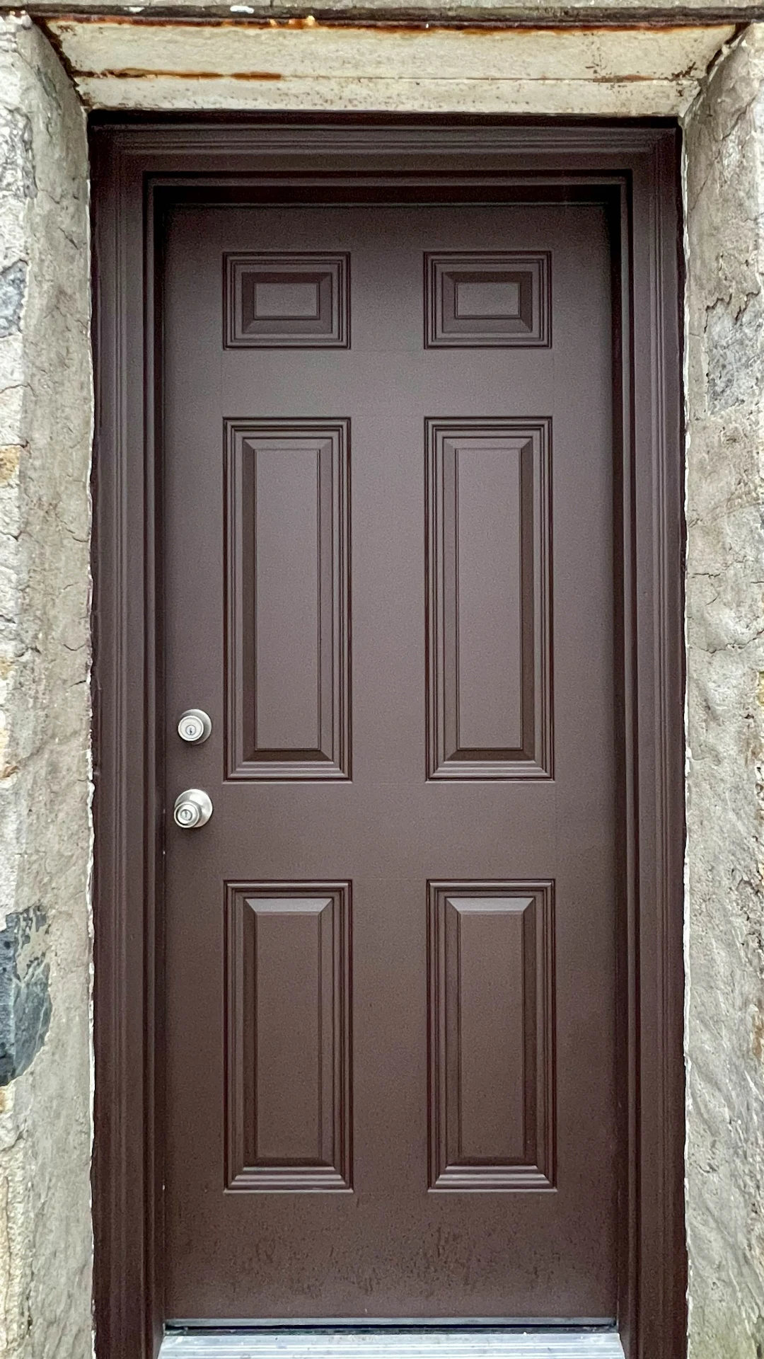 New exterior door fitted into a stone opening