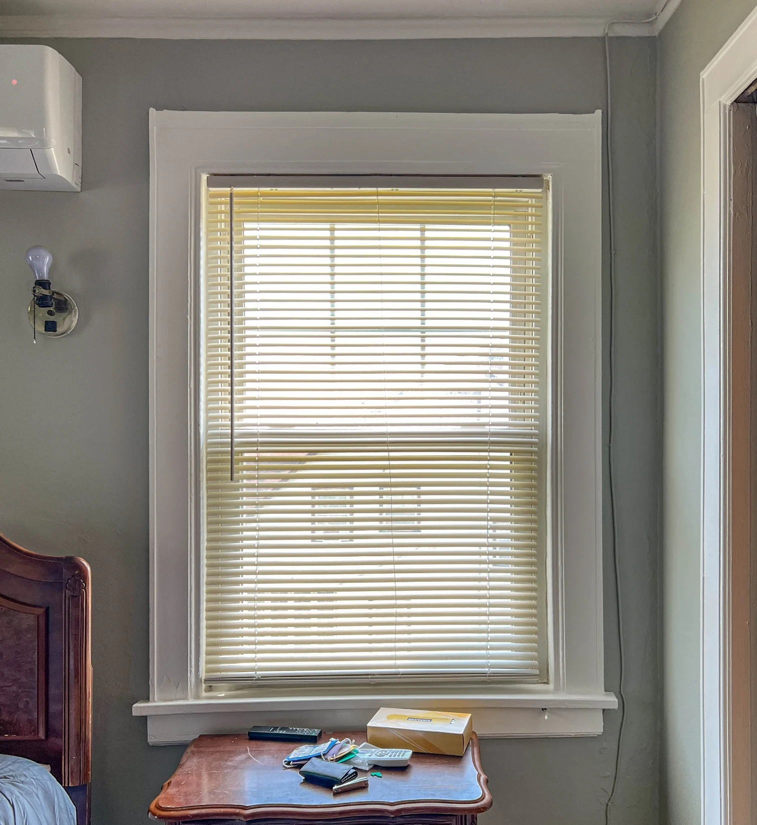 After: the same window with painted walls, white trim and a wall unit fitted