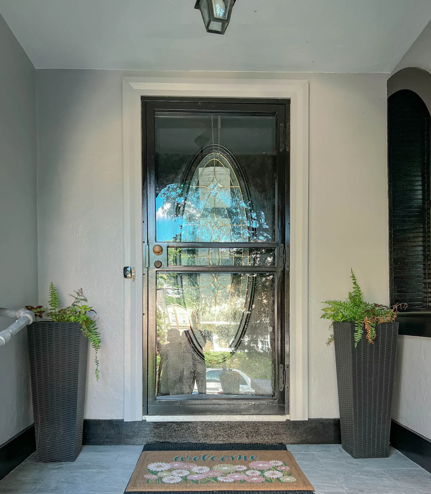 After: the same vestibule painted, with clean trim