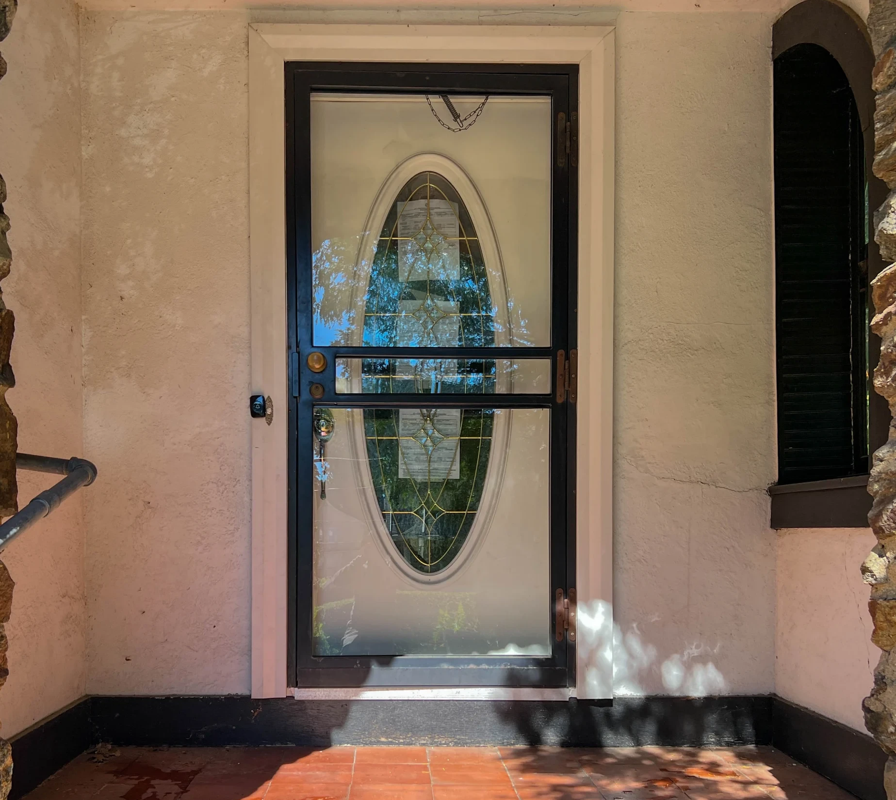 Before: entry vestibule with peeling plaster
