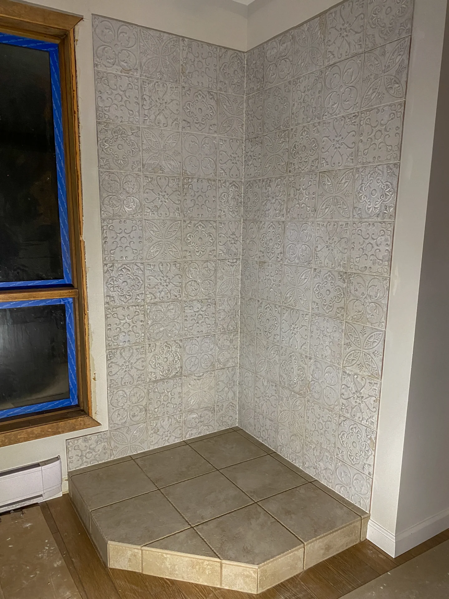 Textured white tile wall, finished